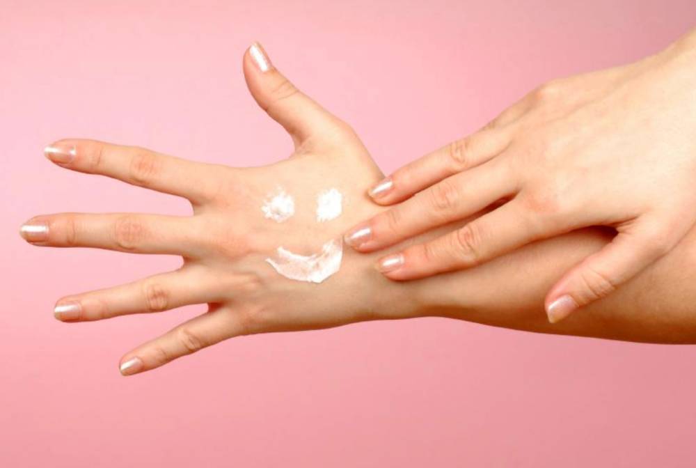 Applying moisturizing creams on hands