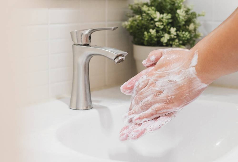 Handwashing with warm water and soap